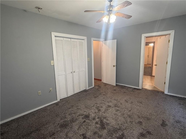 112 N Burns St N, Independence, KS 67301 - unfurnished bedroom featuring carpet flooring, a closet, baseboards, and a ceiling fan