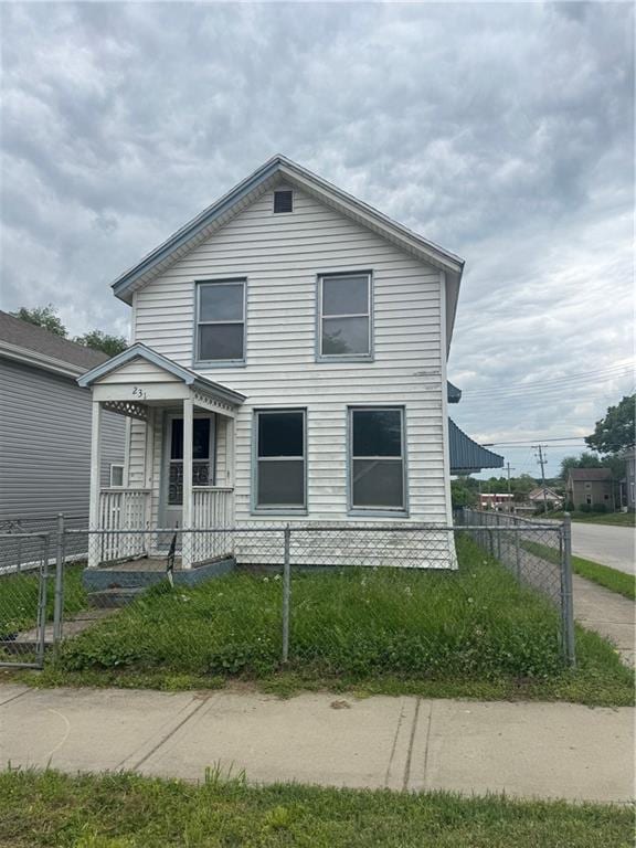 231 Osage St, Leavenworth, KS 66048 - view of front of property featuring a fenced front yard and covered porch