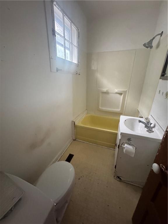 231 Osage St, Leavenworth, KS 66048 - bathroom with vanity, toilet, baseboards, and tub / shower combination
