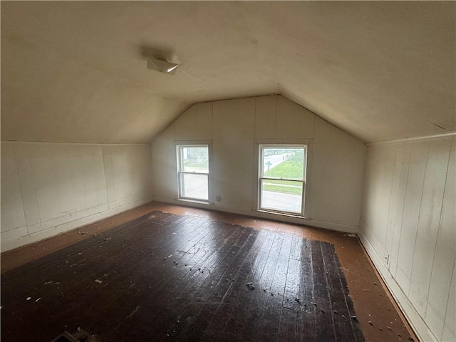 231 Osage St, Leavenworth, KS 66048 - additional living space with wood-type flooring and vaulted ceiling
