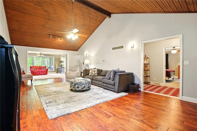 802 High Dr, Excelsior Springs, MO 64024 - living area featuring a ceiling fan, wooden ceiling, hardwood / wood-style floors, beam ceiling, and baseboards