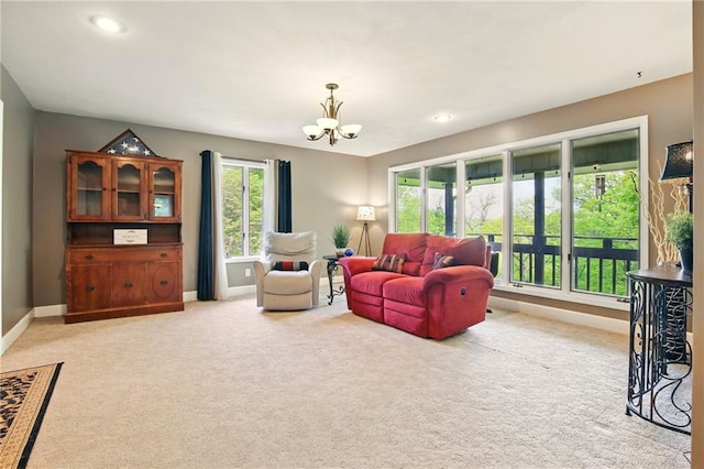 802 High Dr, Excelsior Springs, MO 64024 - living room with a chandelier, baseboards, light carpet, and recessed lighting
