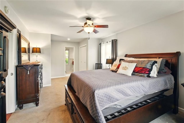 802 High Dr, Excelsior Springs, MO 64024 - bedroom featuring light colored carpet, baseboards, ceiling fan, and connected bathroom