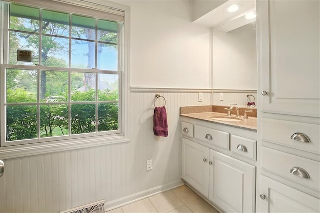 802 High Dr, Excelsior Springs, MO 64024 - bathroom featuring tile patterned floors, vanity, and wainscoting