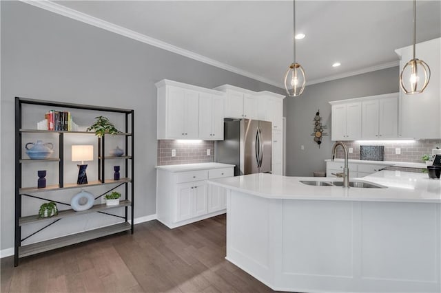 11961 S Tallgrass Dr Unit 403, Olathe, KS 66061 - kitchen with a sink, freestanding refrigerator, backsplash, crown molding, and white cabinets