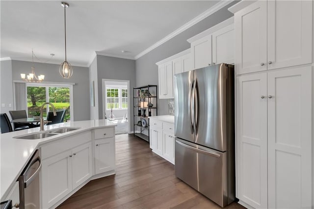 11961 S Tallgrass Dr Unit 403, Olathe, KS 66061 - kitchen featuring appliances with stainless steel finishes, a sink, dark wood-style floors, light countertops, and white cabinets