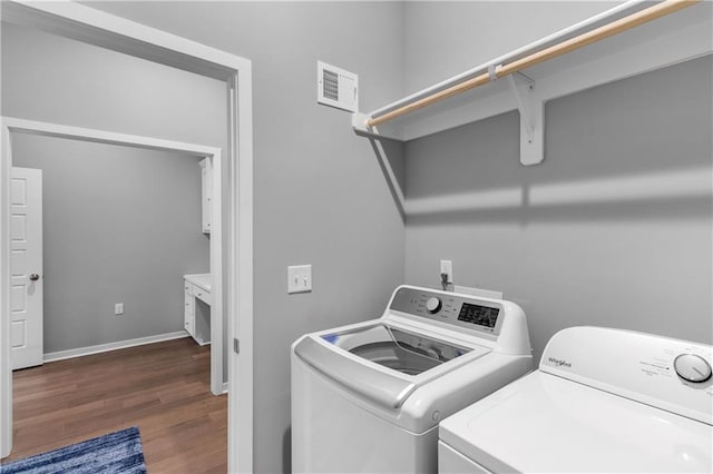 11961 S Tallgrass Dr Unit 403, Olathe, KS 66061 - washroom featuring separate washer and dryer, wood finished floors, and baseboards