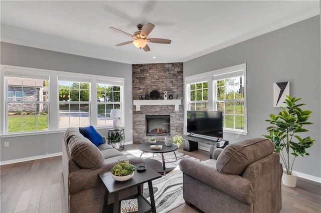 11961 S Tallgrass Dr Unit 403, Olathe, KS 66061 - living area with wood finished floors, ceiling fan, crown molding, and healthy amount of natural light