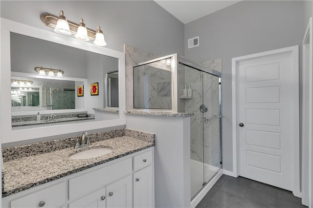 11961 S Tallgrass Dr Unit 403, Olathe, KS 66061 - full bathroom featuring a marble finish shower, tile patterned floors, and vanity