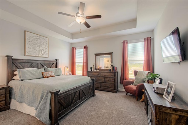 11021 N Oxford Ave, Kansas City, MO 64157 - bedroom with light carpet, a tray ceiling, and ceiling fan