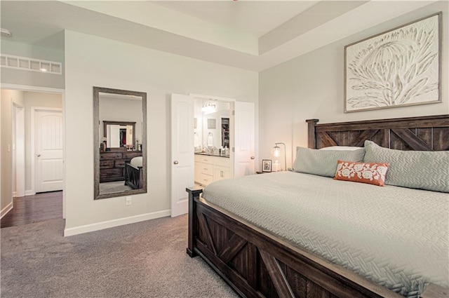 11021 N Oxford Ave, Kansas City, MO 64157 - carpeted bedroom featuring baseboards and ensuite bathroom