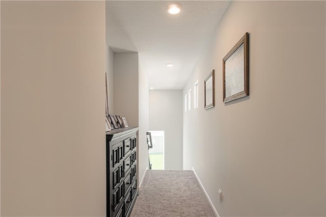 11021 N Oxford Ave, Kansas City, MO 64157 - corridor featuring carpet floors, baseboards, a textured ceiling, and recessed lighting