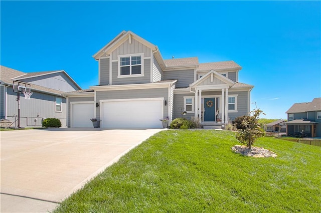 11021 N Oxford Ave, Kansas City, MO 64157 - view of front of property with a garage, a front lawn, concrete driveway, and board and batten siding