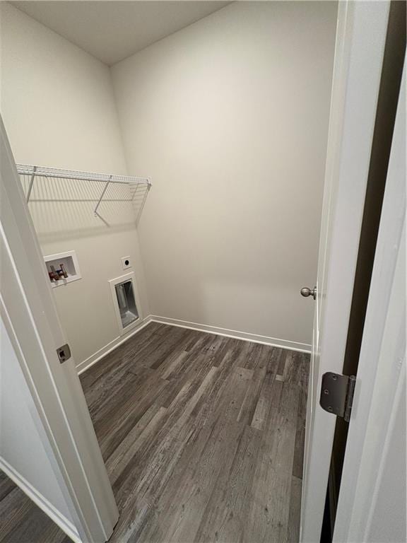 laundry area with dark wood-style floors, hookup for a washing machine, electric dryer hookup, and baseboards