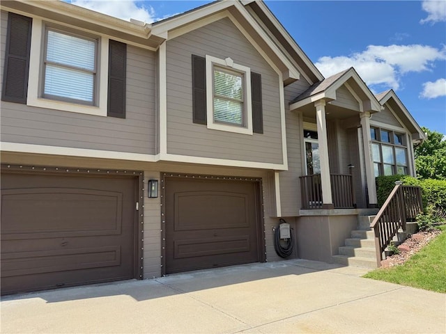 7703 NE 74th Ter, Kansas City, MO 64158 - view of front of house featuring an attached garage and driveway
