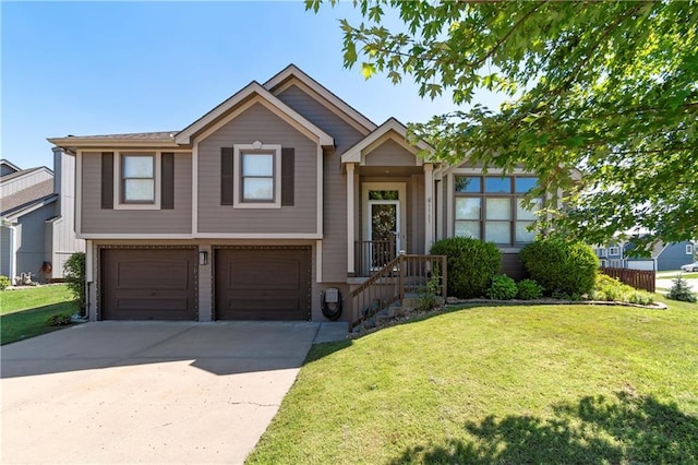 7703 NE 74th Ter, Kansas City, MO 64158 - tri-level home with an attached garage, concrete driveway, and a front lawn