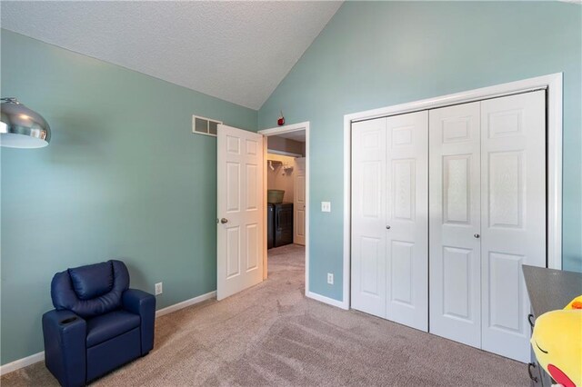 7703 NE 74th Ter, Kansas City, MO 64158 - unfurnished room with vaulted ceiling, carpet floors, and a textured ceiling