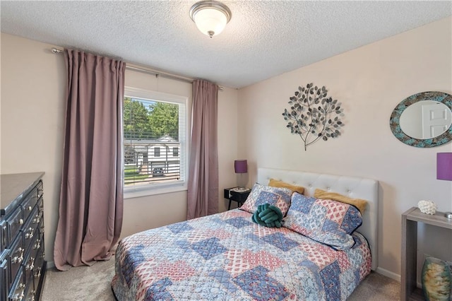 7703 NE 74th Ter, Kansas City, MO 64158 - carpeted bedroom with a textured ceiling