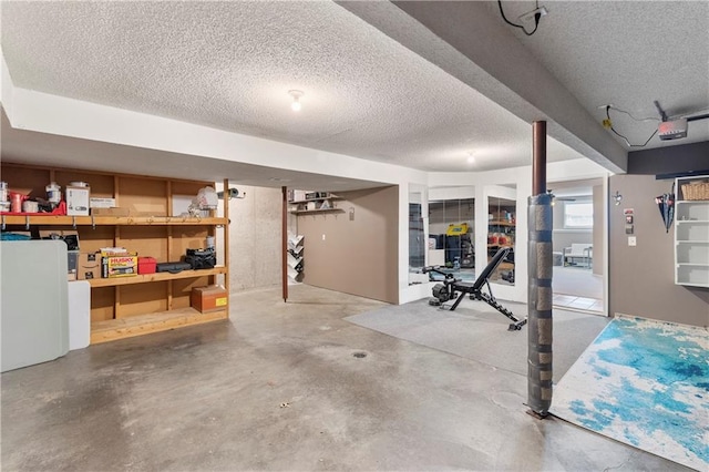 7703 NE 74th Ter, Kansas City, MO 64158 - below grade area featuring a textured ceiling