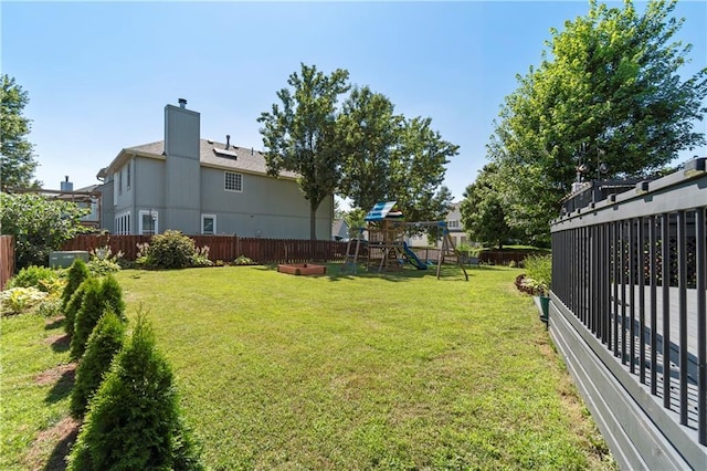 7703 NE 74th Ter, Kansas City, MO 64158 - fenced backyard featuring a playground