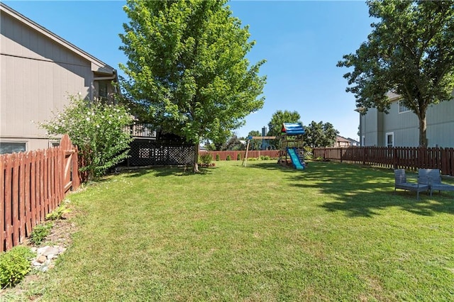 7703 NE 74th Ter, Kansas City, MO 64158 - fenced backyard featuring a playground
