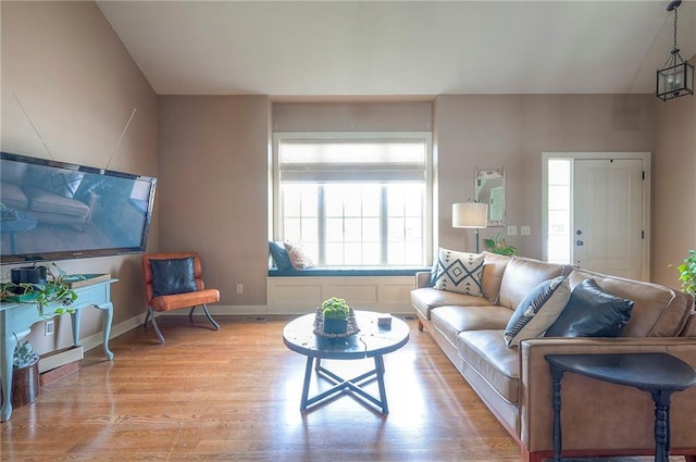 10111 N Tullis Dr, Kansas City, MO 64157 - living room featuring light wood-style flooring and baseboards