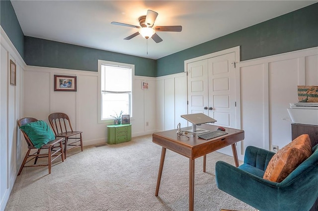10111 N Tullis Dr, Kansas City, MO 64157 - home office featuring a ceiling fan, a decorative wall, and light colored carpet