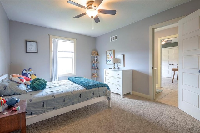 10111 N Tullis Dr, Kansas City, MO 64157 - bedroom with light carpet, ceiling fan, and baseboards