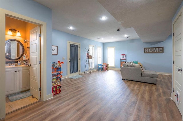 10111 N Tullis Dr, Kansas City, MO 64157 - living room featuring wood finished floors, baseboards, and recessed lighting
