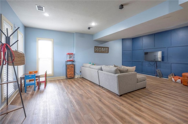10111 N Tullis Dr, Kansas City, MO 64157 - living area with wood finished floors, recessed lighting, and baseboards