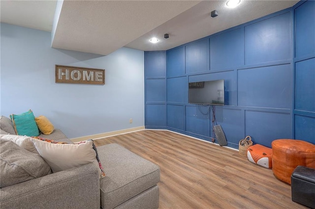 10111 N Tullis Dr, Kansas City, MO 64157 - living area featuring wood finished floors, baseboards, and recessed lighting