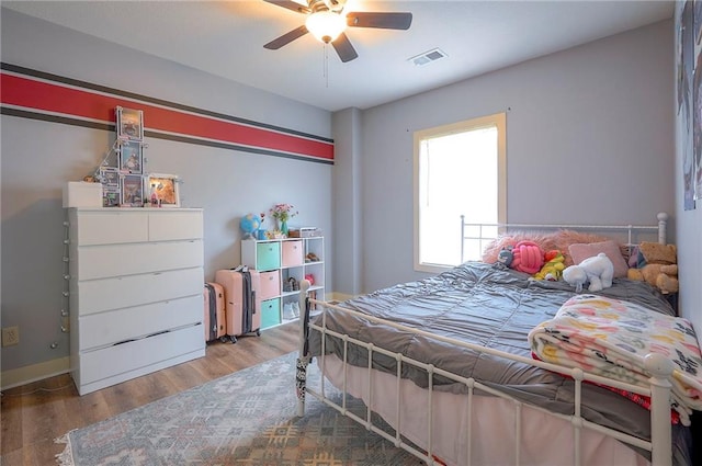 10111 N Tullis Dr, Kansas City, MO 64157 - bedroom with wood finished floors and ceiling fan