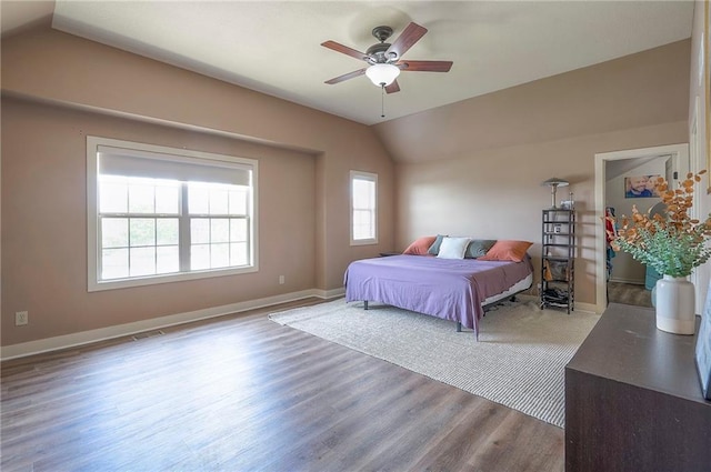 10111 N Tullis Dr, Kansas City, MO 64157 - bedroom with vaulted ceiling, wood finished floors, baseboards, and ceiling fan