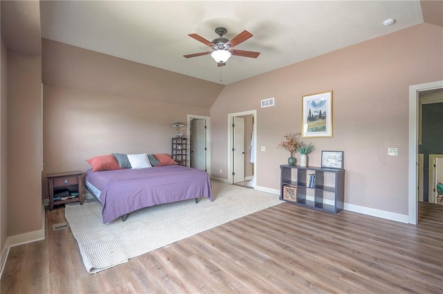 10111 N Tullis Dr, Kansas City, MO 64157 - bedroom with lofted ceiling, wood finished floors, baseboards, and ceiling fan