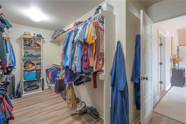 10111 N Tullis Dr, Kansas City, MO 64157 - spacious closet with wood finished floors