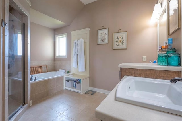 10111 N Tullis Dr, Kansas City, MO 64157 - full bathroom with a sink, tile patterned floors, a stall shower, vaulted ceiling, and baseboards