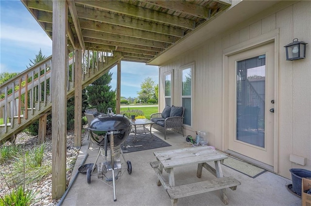 10111 N Tullis Dr, Kansas City, MO 64157 - view of patio / terrace featuring stairs and an outdoor living space