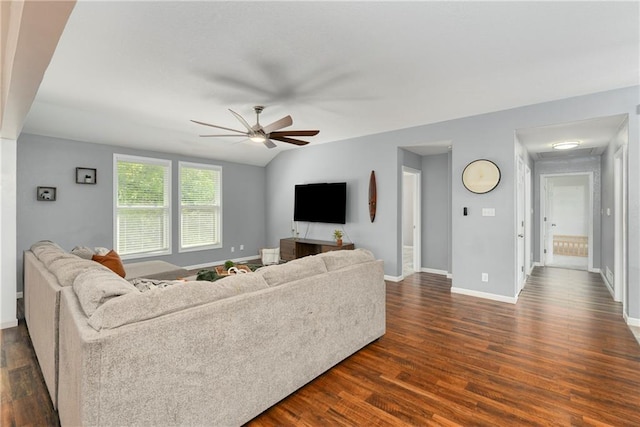 living room with ceiling fan, dark wood finished floors, and baseboards