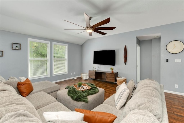 living room featuring ceiling fan, baseboards, and wood finished floors