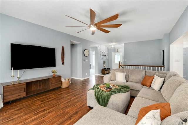 living room with a ceiling fan, wood finished floors, and baseboards