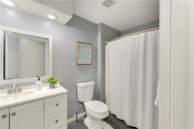 bathroom with toilet, vanity, tile patterned flooring, baseboards, and a shower with shower curtain