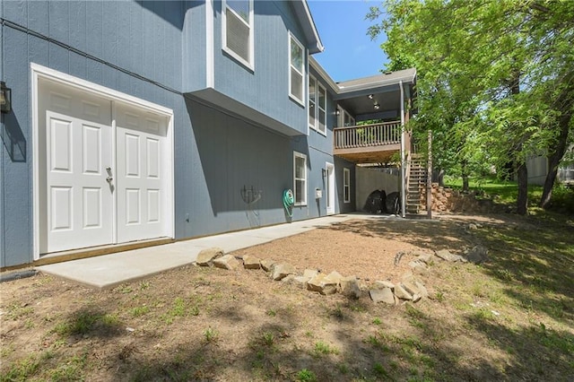 back of property with stairs