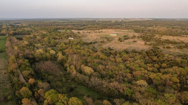 23249 NW Mitchell Rd, Garnett, KS 66032 - aerial view of property and surrounding area with a heavily wooded area