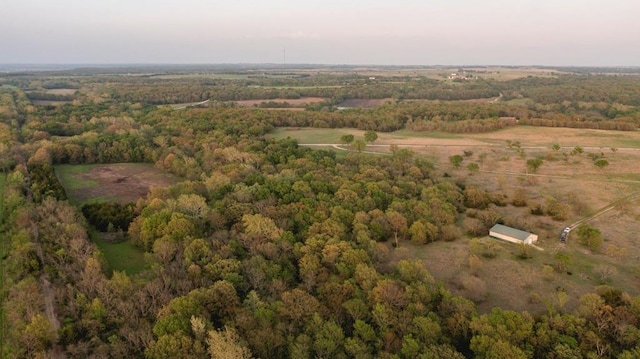 23249 NW Mitchell Rd, Garnett, KS 66032 - aerial view of property and surrounding area with a heavily wooded area and rural landscape