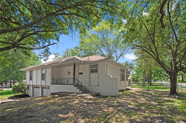 13300 Palmer Ave, Grandview, MO 64030 - view of front of house featuring an attached garage and brick siding