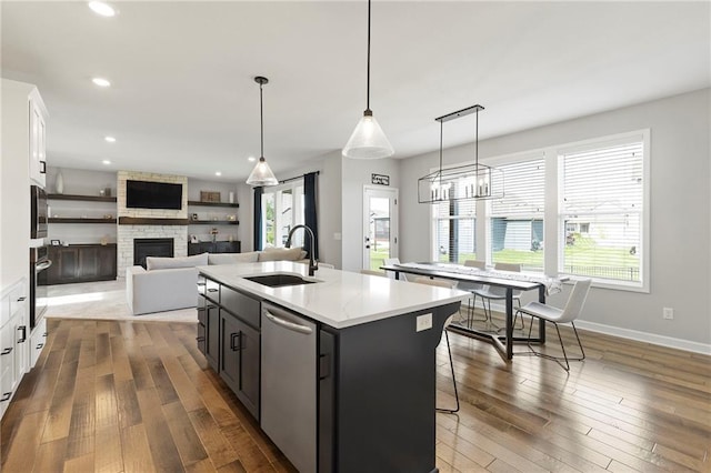 16780 W 170th Ct, Olathe, KS 66062 - kitchen featuring a sink, appliances with stainless steel finishes, white cabinetry, wood-type flooring, and recessed lighting