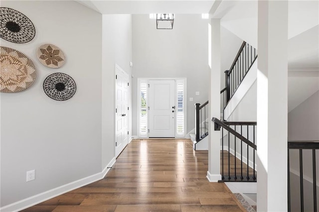 16780 W 170th Ct, Olathe, KS 66062 - entrance foyer featuring a towering ceiling, hardwood / wood-style floors, stairway, and baseboards