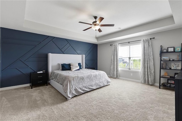 16780 W 170th Ct, Olathe, KS 66062 - carpeted bedroom featuring a raised ceiling, baseboards, a decorative wall, an accent wall, and a ceiling fan