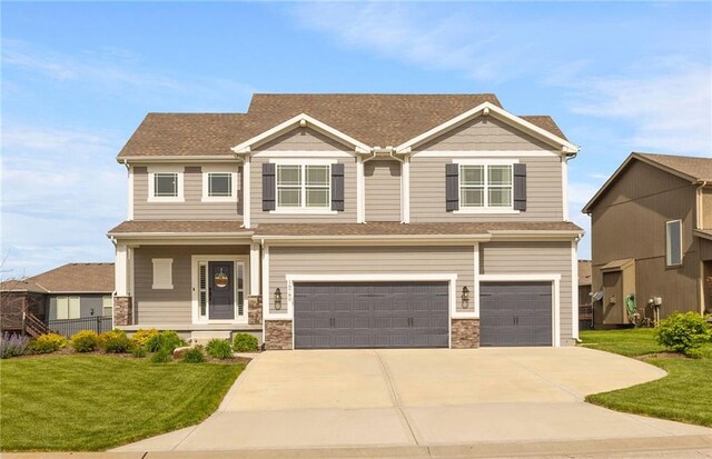 16780 W 170th Ct, Olathe, KS 66062 - craftsman inspired home with a garage, a front yard, driveway, and a shingled roof