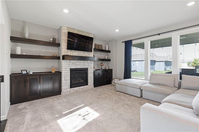 16780 W 170th Ct, Olathe, KS 66062 - carpeted living room with a large fireplace and recessed lighting